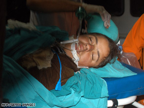 A young girl is comforted by a relative in the aftermath of the attack which killed 44 people.