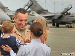 An RAF pilot greets his family earlier this month in England on his return from Iraq.
