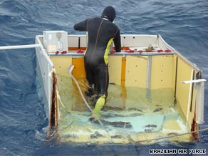 A Brazilian diver floats on wreckage of Flight 447 spotted last week.