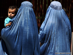 Women wearing burkas walk in Kabul, Afghanistan, on June 17.