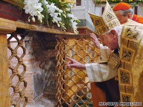 Pope Benedict XVI looks at the tomb of St. Paul at the Basilica of St. Paul in Rome in 2007.