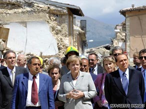 German Chancellor Angela Merkel, center, and Italian PM Silvio Berlusconi, right, visit the quake zone.