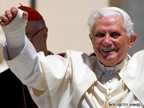The pope celebrates mass with his broken wrist in plaster.