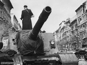 A Soviet tank rolls through Budapest during the failed 1956 Hungarian uprising against communist domination.