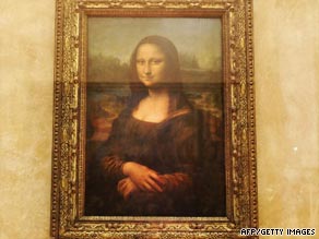 The "Mona Lisa" sits behind bulletproof glass in the Louvre gallery.