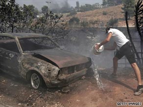 Aircraft were mobilized Saturday to help firefighters battle a blaze northeast of Athens, Greece.