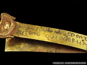 A gold strip with a Biblical inscription was among the 1,500 pieces unearthed in an English field.