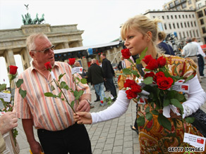 Social Democrats handing out flowers hope their party will stay in the ruling coalition.