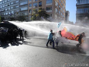 Riot police repel protesters in Turkey with water as they demonstrate near the IMF/World Bank meeting, October 7.