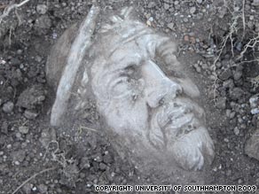 The statue head as it appeared beneath the soil during excavations at the site in Fumicino in early 2009.