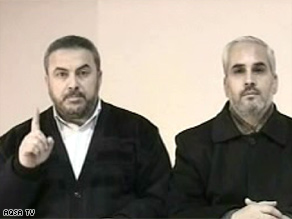 Hamas spokesmen Ismail Radwan, left, and Fawzi Barhoum appeared Saturday on television station Al-Aqsa.