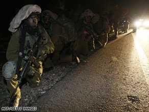 An Israeli woman cries out Saturday as a Hamas rocket strikes close by in Ashdod, Israel.