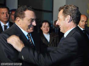 Egyptian President Hosni Mubarak, left, welcomes French President Nicholas Sarkozy in Egypt Tuesday.