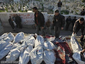 Palestinians prepare Tuesday to bury members of a family they said died in an Israeli airstrike in Gaza City.