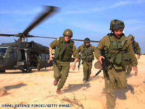 In a handout photo from Israel Defense Forces, troops deploy Tuesday in northern Gaza.