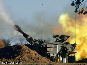 An Israeli army artillery battery fires a smoke bomb into the Gaza Strip from its border.