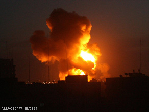 Flames rise into the sky after an Israeli airstrike Wednesday night in Rafa, on the Gaza-Egypt border.