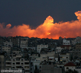 http://i2.cdn.turner.com/cnn/2009/WORLD/meast/01/09/israel.gaza/t1home.jabalia.gaza.smoke.afp.gi.jpg