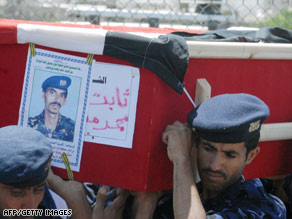 Yemeni soldiers carry the coffin of a comrade killed in September's attack on the U.S. Embassy.