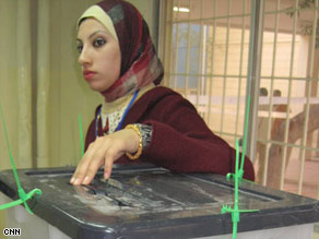 An Iraqi casts her ballot Saturday in Baghdad. About 4,000 women are running for office.