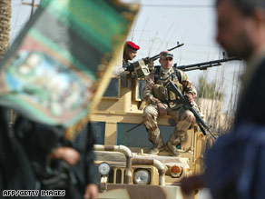 Pilgrims walk toward Karbala on Tuesday to mark the religious holiday al-Arbaeen.