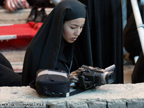 Authorities say journalist Roxana Saberi, shown working in Iran in 2004, has confessed to spying charges.