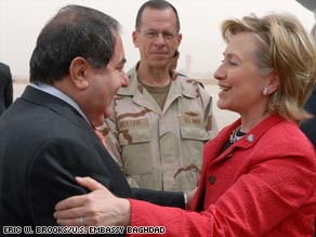 U.S. and Iraqi officials greet Secretary of State Hillary Clinton on her arrival Saturday in Baghdad.