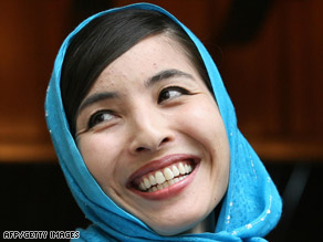 Roxana Saberi smiles ouside her home in Tehran, Iran, on Tuesday. - art.saberi805.afp.gi