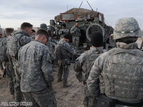 U.S. Army troops get a safety briefing before departing Camp Liberty, Iraq, in December 2008.