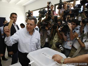 Lebanese Prime Minister Foad Siniora casts his vote at a polling station in southern Lebanon.