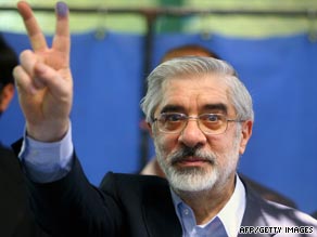 Presidential candidate Mir Hossein Mousavi holds up the "V" sign after casting his vote on Friday.