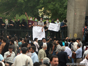 Supporters of Iran's defeated presidential candidate Mir Hossein Moussavi protest on Sunday.