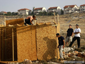 Settlers rebuild a structure on June 9 destroyed by Israeli security forces near Kokhav Ha Shahar settlement.