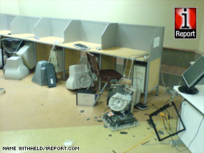 The aftermath of anti-riot police actions at Tehran University shows smashed computer terminals.