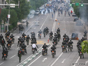 Protesters fight running battles with motorcycle-mounted militia members Saturday in Tehran