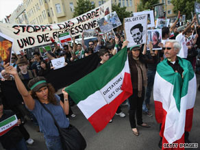 Iranian expatriates protest the June 12 presidential election results on Sunday in Berlin, Germany.