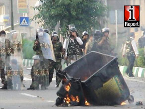 Members of the Basij paramilitary block a road leading to Freedom Square in Tehran.