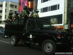 Riot police patrol a Tehran street earlier this week. Security forces are ever-present, one Iranian says.