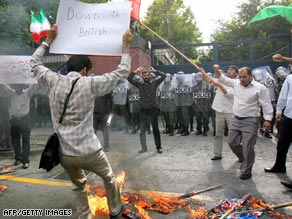 Students are shown burning British and U.S. flags outside the British embass in Tehran last week.