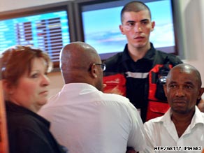 Relatives of passengers of the plane that crashed await news at Marseille airport in southern France.