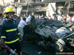 A crowd gathers Tuesday after a deadly bombing in the northern Iraqi city of Kirkuk.