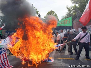 Iranian hardline students burn U.S. and British flags outside British embassy in Tehran on June 23.