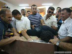 Family members of Rizko Aziz Nissan grieve before his funeral in Kirkuk, Iraq, on Sunday.