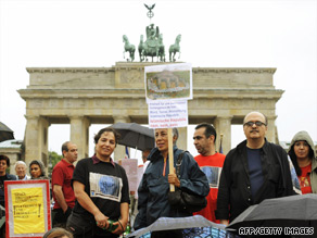 A small group of protesters at Berlin's Brandenburg Gate on Friday.