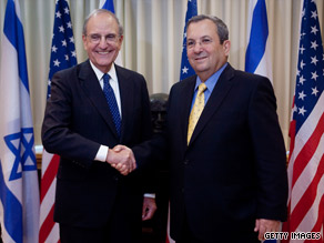 After meeting with al-Assad, Mitchell greets Ehud Barak, Israel's defense minister, before their meeting in Tel Aviv.