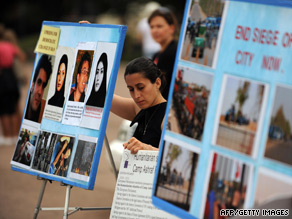 A woman protests the takeover of Camp Ashraf by Iraqi forces in front of the White House on Wednesday.