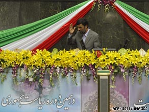 Ahmadinejad waves after being sworn in as Iranian president for a second time.