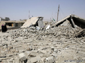 Houses are left in ruins earlier this week after truck bombings in the northern Iraqi village of al-Khazna.