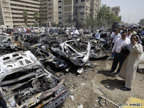 Plumes of smoke and dust billow from a car bomb Wednesday in Baghdad