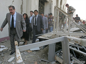 Iraqi Foreign Minister Hoshyar Zebari inspects damage to his building after Wednesday's bombing.